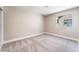 Neutral bedroom featuring a carpeted floor and window at 4149 Compass Rose Way, Las Vegas, NV 89108