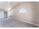 Bright bedroom showcasing vaulted ceiling, carpeted floors, and a large window at 4149 Compass Rose Way, Las Vegas, NV 89108