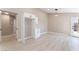 Open-concept dining area featuring modern lighting and wood-look floors at 4149 Compass Rose Way, Las Vegas, NV 89108