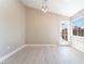 Dining area featuring modern lighting and a door to the backyard at 4149 Compass Rose Way, Las Vegas, NV 89108