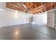 Spacious garage with ample lighting, painted walls, and sealed concrete flooring at 4149 Compass Rose Way, Las Vegas, NV 89108