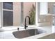 Kitchen sink with a modern faucet and a view of the backyard at 4149 Compass Rose Way, Las Vegas, NV 89108