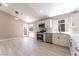 Bright kitchen featuring white cabinets, stainless steel appliances, and pendant lights at 4149 Compass Rose Way, Las Vegas, NV 89108