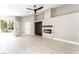 Bright living room featuring a contemporary fireplace, wood-look floors, and recessed lighting at 4149 Compass Rose Way, Las Vegas, NV 89108