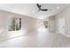Open-concept living room with neutral walls and wood-look floors at 4149 Compass Rose Way, Las Vegas, NV 89108