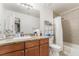 Well-lit bathroom with granite counters, neutral wall color and a shower-tub combination at 4200 S Valley View Blvd # 1074, Las Vegas, NV 89103