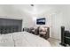 Comfortable bedroom with accent chairs, and a mounted television at 4200 S Valley View Blvd # 1074, Las Vegas, NV 89103