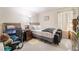 Cozy bedroom with plush carpeting, natural light, and a comfortable bed setting at 4200 S Valley View Blvd # 1074, Las Vegas, NV 89103
