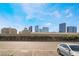 Expansive city view featuring high-rise buildings with a parking area in the foreground and blue skies above at 4200 S Valley View Blvd # 1074, Las Vegas, NV 89103