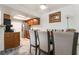 Bright dining area with views to the kitchen, stainless steel appliances, and natural light at 4200 S Valley View Blvd # 1074, Las Vegas, NV 89103