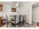Cozy dining area with a glass-top table, comfortable chairs, and a modern ceiling fan at 4200 S Valley View Blvd # 1074, Las Vegas, NV 89103