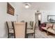 Bright dining area with glass table, seating for six, and access to other living spaces at 4200 S Valley View Blvd # 1074, Las Vegas, NV 89103