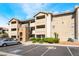 Condo building featuring multiple stories, a parking lot, and well-maintained landscaping at 4200 S Valley View Blvd # 1074, Las Vegas, NV 89103