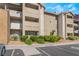 Condo building featuring multiple stories, a parking lot, and well-maintained landscaping at 4200 S Valley View Blvd # 1074, Las Vegas, NV 89103