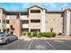 Condo building featuring multiple stories, a parking lot, and well-maintained landscaping at 4200 S Valley View Blvd # 1074, Las Vegas, NV 89103