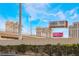 Caesars Palace with freeway and billboards in the background, taken from behind a bush-lined wall at 4200 S Valley View Blvd # 1074, Las Vegas, NV 89103