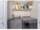 Convenient laundry room with modern washer and dryer units and storage shelf at 4200 S Valley View Blvd # 1074, Las Vegas, NV 89103