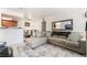 Comfortable living room featuring a large sectional sofa, decorative pillows, and view of the dining area at 4200 S Valley View Blvd # 1074, Las Vegas, NV 89103