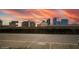The buildings in the distance are shown against a sunset painted sky backdrop at 4200 S Valley View Blvd # 1074, Las Vegas, NV 89103