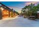 Expansive backyard with a covered patio, outdoor dining area, and a luxurious pool and spa at 4200 Scott Peak Ct, Las Vegas, NV 89129