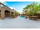 Expansive backyard featuring a pool, dining area, and mature landscaping at 4200 Scott Peak Ct, Las Vegas, NV 89129