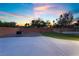 Large backyard features a brick-paved fire pit and a putting green for outdoor entertainment at 4200 Scott Peak Ct, Las Vegas, NV 89129