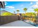 Large balcony offers city views with elegant wrought iron railings and landscaped surroundings at 4200 Scott Peak Ct, Las Vegas, NV 89129