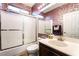 Well-lit bathroom with a shower-tub combo and decorative red wallpaper at 4200 Scott Peak Ct, Las Vegas, NV 89129