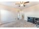 Clean bedroom with neutral tones featuring a ceiling fan and closet with sliding mirror doors at 4200 Scott Peak Ct, Las Vegas, NV 89129