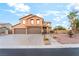 Charming two-story home with desert landscaping and a three-car garage at 4200 Scott Peak Ct, Las Vegas, NV 89129