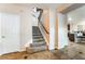 Welcoming foyer with staircase, tile flooring, and a glimpse of the kitchen at 4200 Scott Peak Ct, Las Vegas, NV 89129
