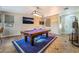 Well lit game room featuring a pool table, mounted TV, and dart board at 4200 Scott Peak Ct, Las Vegas, NV 89129