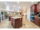Open concept kitchen features a large island, granite countertops, and seamless access to dining and living areas at 4200 Scott Peak Ct, Las Vegas, NV 89129