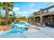 A stunning pool and hot tub area set in the private backyard oasis at 4200 Scott Peak Ct, Las Vegas, NV 89129