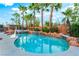 Lush tropical plants surround this freeform pool and spa creating your own private oasis at 4200 Scott Peak Ct, Las Vegas, NV 89129
