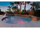 Beautiful in-ground pool features a rock waterfall, spa, and basketball hoop; great for entertaining at 4200 Scott Peak Ct, Las Vegas, NV 89129