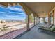 Long covered balcony with lounge chairs and beautiful views of the surrounding area at 440 N Lisbon St, Henderson, NV 89015