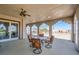 Covered balcony with seating, offering scenic views through arched openings at 440 N Lisbon St, Henderson, NV 89015