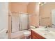 Bathroom with a shower-tub combo and white sink at 440 N Lisbon St, Henderson, NV 89015