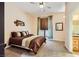 Comfortable bedroom with ceiling fan, carpet, and neutral paint at 440 N Lisbon St, Henderson, NV 89015