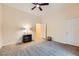 Spacious bedroom featuring neutral carpet, a ceiling fan, and great natural light at 440 N Lisbon St, Henderson, NV 89015
