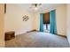 Bedroom featuring neutral carpet, ceiling fan, and custom window treatments at 440 N Lisbon St, Henderson, NV 89015