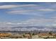 Scenic view of the Las Vegas skyline and surrounding mountains under a bright, cloudy sky at 440 N Lisbon St, Henderson, NV 89015