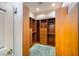 Walk-in closet featuring custom wood shelving and drawers to maximize storage at 440 N Lisbon St, Henderson, NV 89015