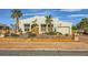 Charming single-story home featuring stucco exterior, desert landscaping, and an attached two-car garage at 440 N Lisbon St, Henderson, NV 89015