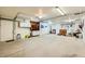 Spacious garage with ample storage, featuring built-in cabinets and room for various equipment at 440 N Lisbon St, Henderson, NV 89015