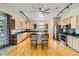 Well-lit kitchen featuring stainless steel appliances and a center island with barstool seating at 440 N Lisbon St, Henderson, NV 89015