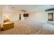 Spacious carpeted living room with ceiling fan, recessed lighting, and neutral walls at 440 N Lisbon St, Henderson, NV 89015