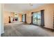 Spacious living room with fireplace and sliding glass doors leading to backyard at 440 N Lisbon St, Henderson, NV 89015