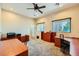 Office with carpet, windows with blinds, and ample desk and storage space at 440 N Lisbon St, Henderson, NV 89015